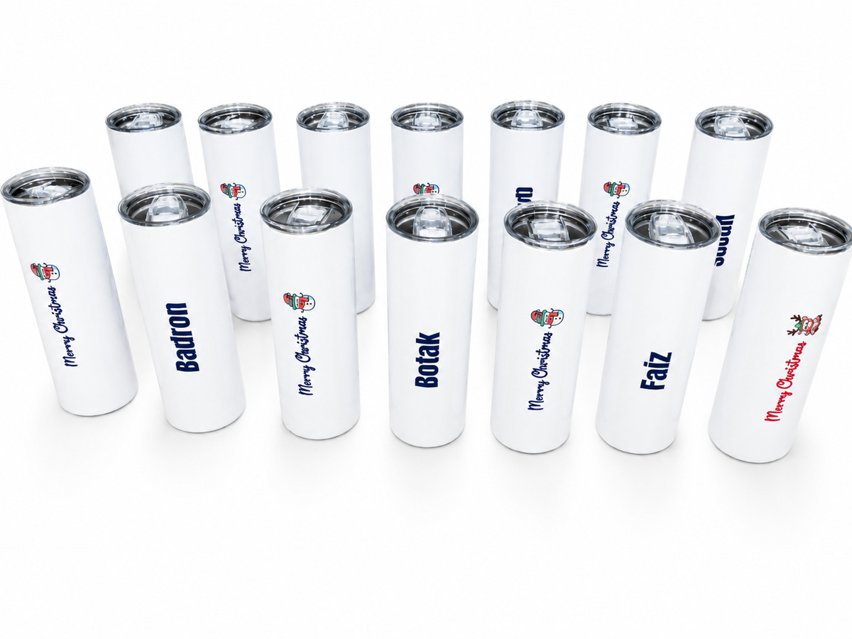White skinny tumblers with personalised names and colourful Christmas designs