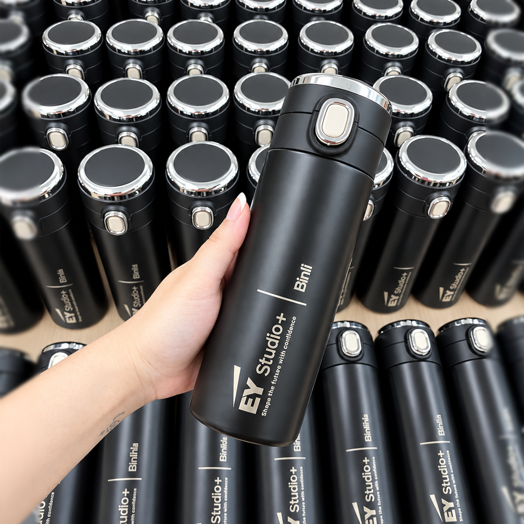 Black 400ml digital tumblers featuring EY Studio+ branding and laser-engraved individual names.
