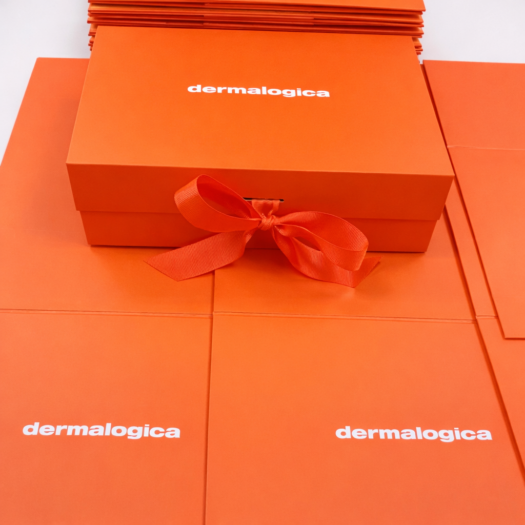 Orange premium gift box customised with Dermalogica branding logo